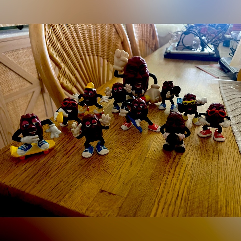10 Vintage California raisins, and one large plastic wind up California raisin.